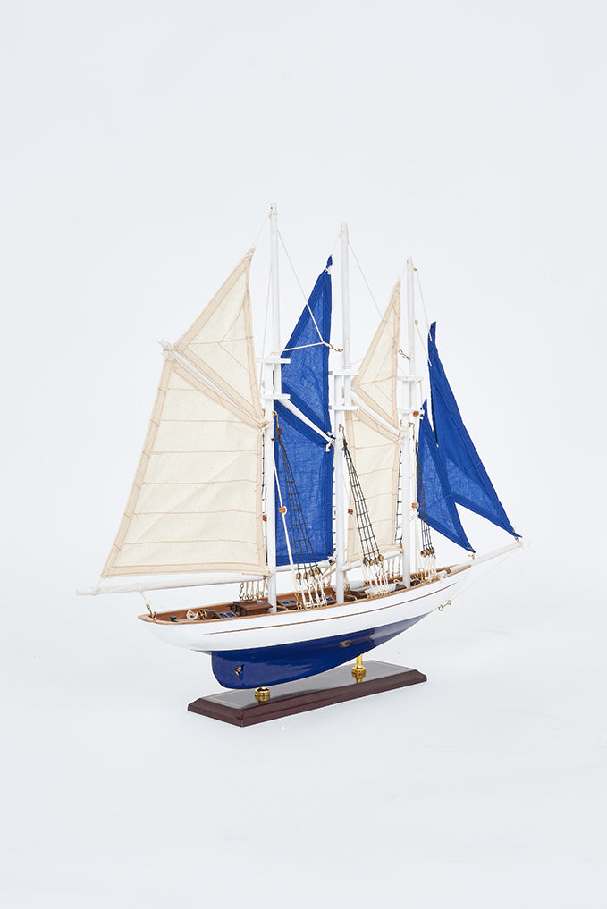 White and blue 3 mast sailing boat