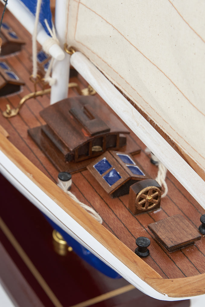 White and blue 3 mast sailing boat