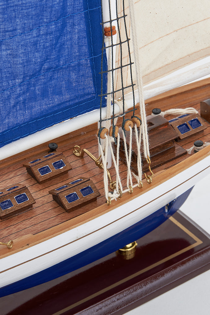 White and blue 3 mast sailing boat