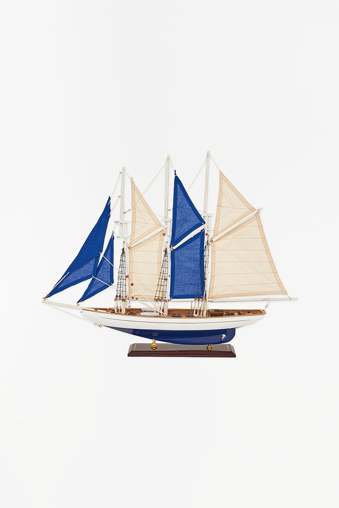 White and blue 3 mast sailing boat