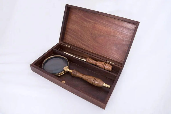 Wooden box with magnifying glass and letter opener