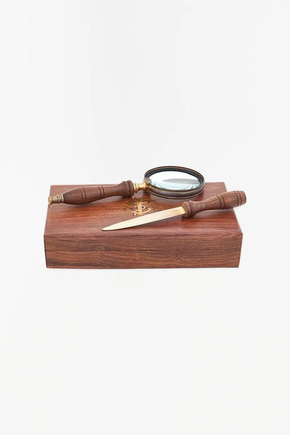 Wooden box with magnifying glass and letter opener